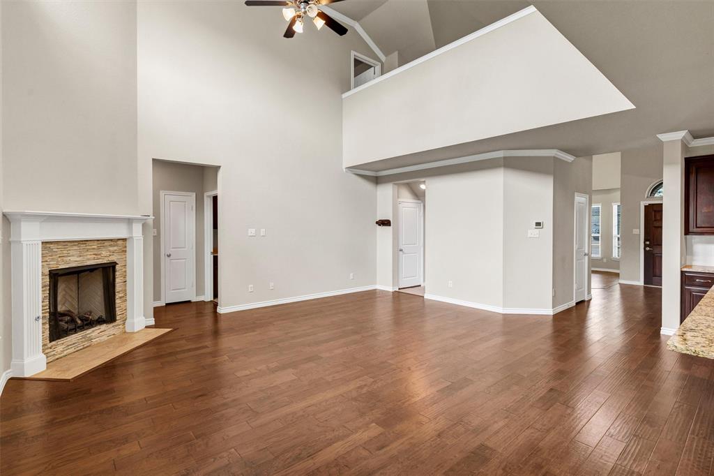 420 Prairie Run Aledo, TX 76008 - Photo 13 of 37 a view of an empty room with wooden floor fireplace and a window
