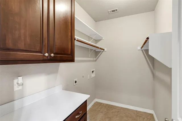 a view of storage and utility room with a sink
