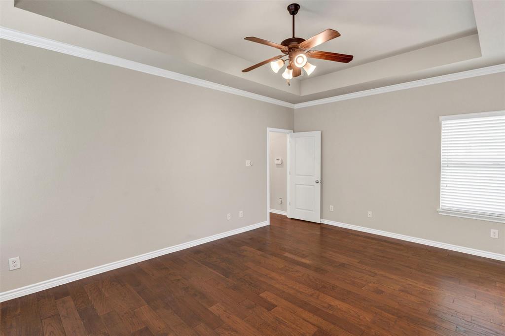 420 Prairie Run Aledo, TX 76008 - Photo 20 of 37 an empty room with wooden floor chandelier and windows