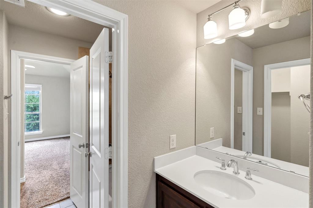 420 Prairie Run Aledo, TX 76008 - Photo 27 of 37 a bathroom with a sink and a mirror