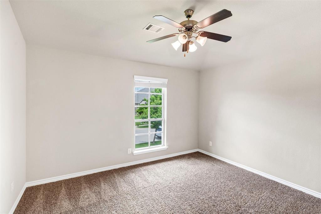 420 Prairie Run Aledo, TX 76008 - Photo 28 of 37 an empty room with windows and fan