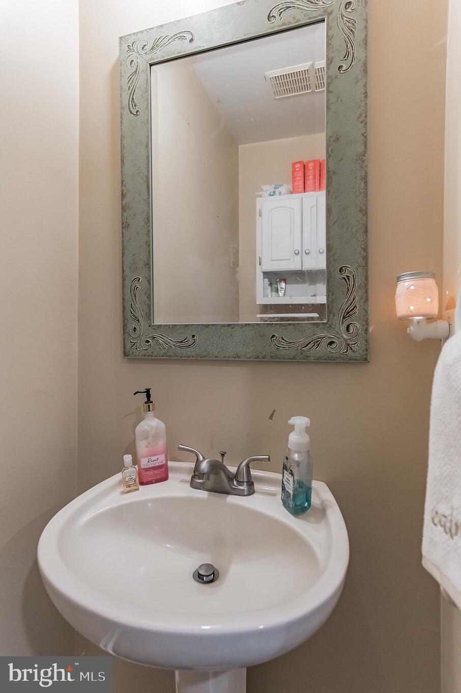 285 Hilltop Road Lusby, MD 20657 - Photo 18 of 28 Half Bath Main Level with Pedestal Sink