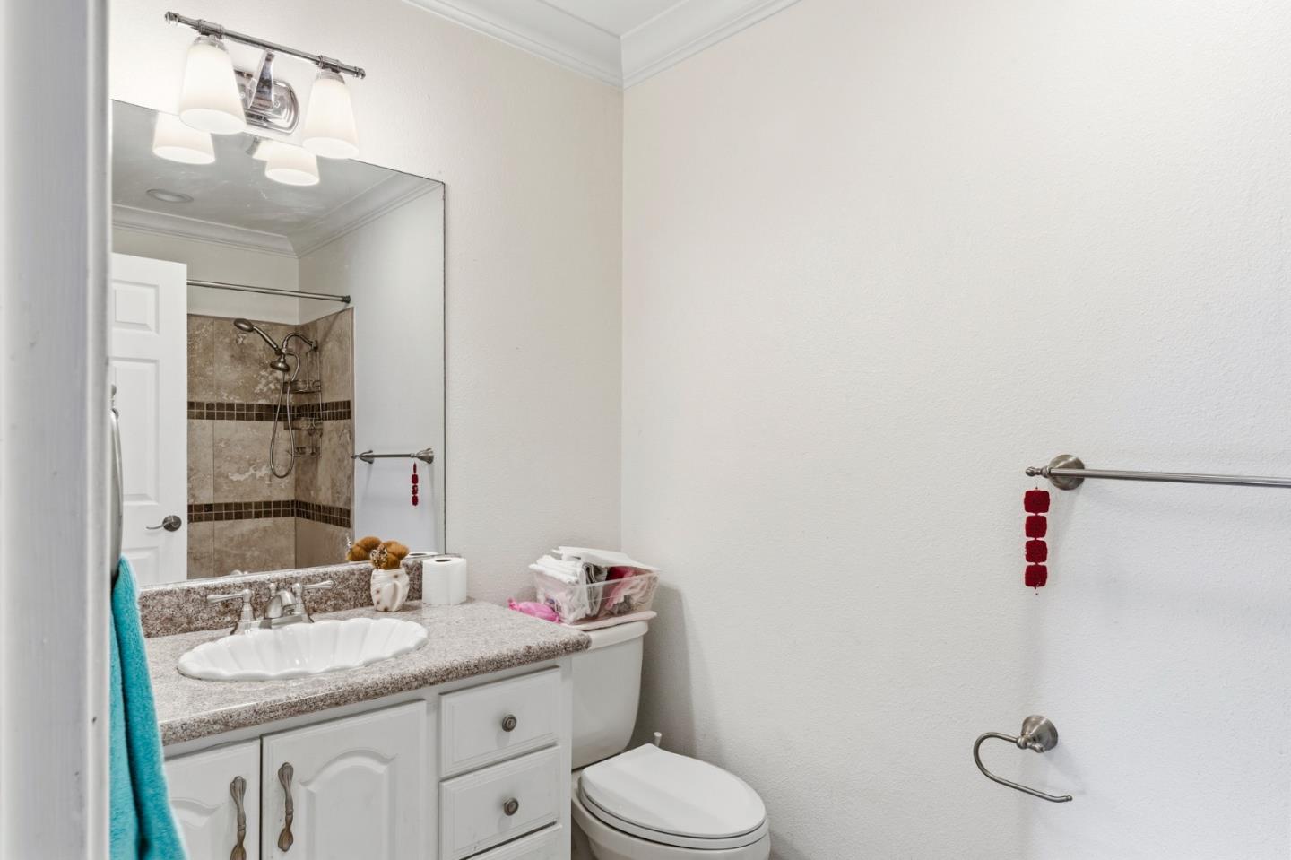 1743 Panda Way Hayward, CA 94541 - Photo 28 of 34 a bathroom with a granite countertop sink mirror and toilet