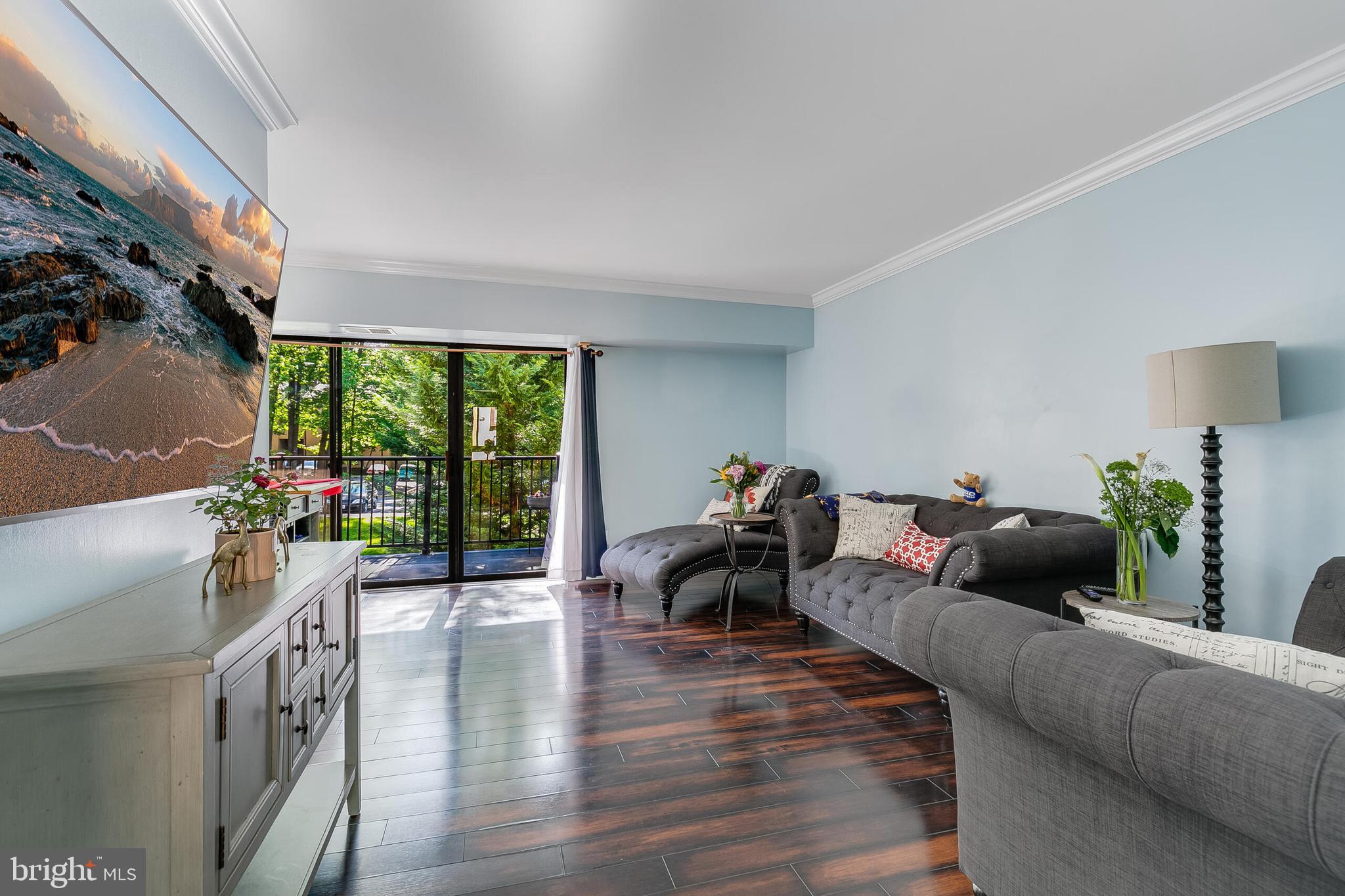 2255 Castle Rock Square, Unit 12C Reston, VA 20191 - Photo 11 of 29 a living room with furniture and a large window