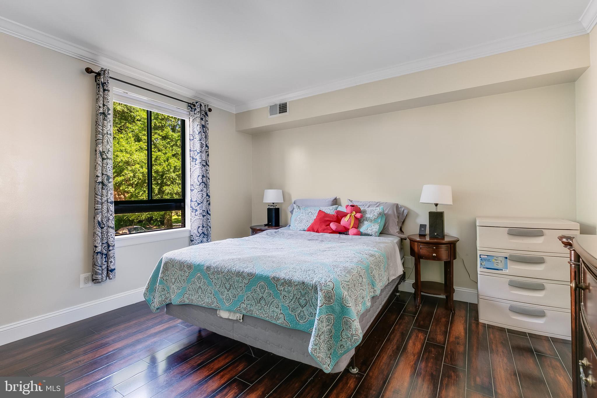 2255 Castle Rock Square, Unit 12C Reston, VA 20191 - Photo 12 of 29 a bedroom with a bed and a window