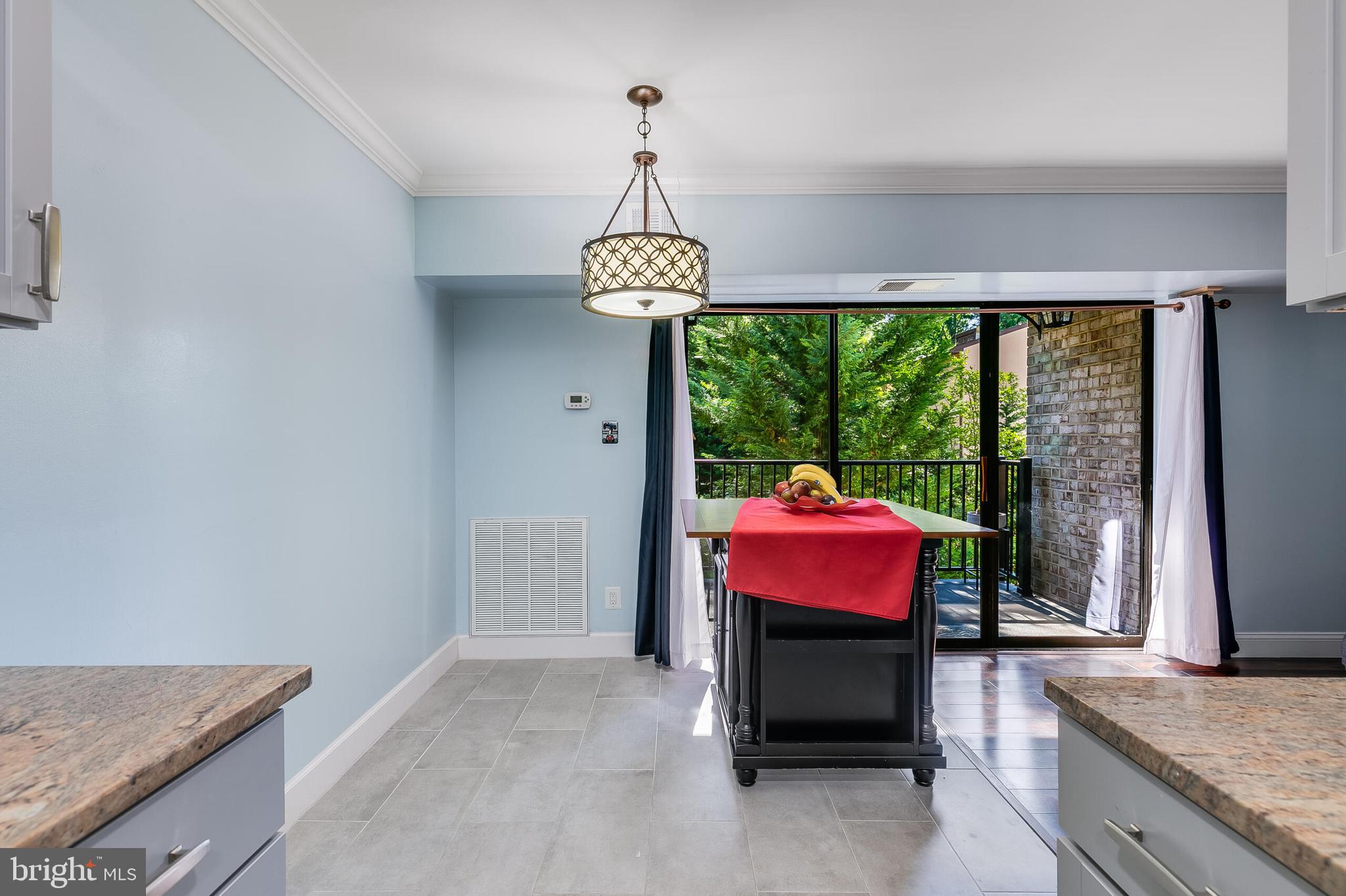 2255 Castle Rock Square, Unit 12C Reston, VA 20191 - Photo 4 of 29 a living room with furniture and floor to ceiling window