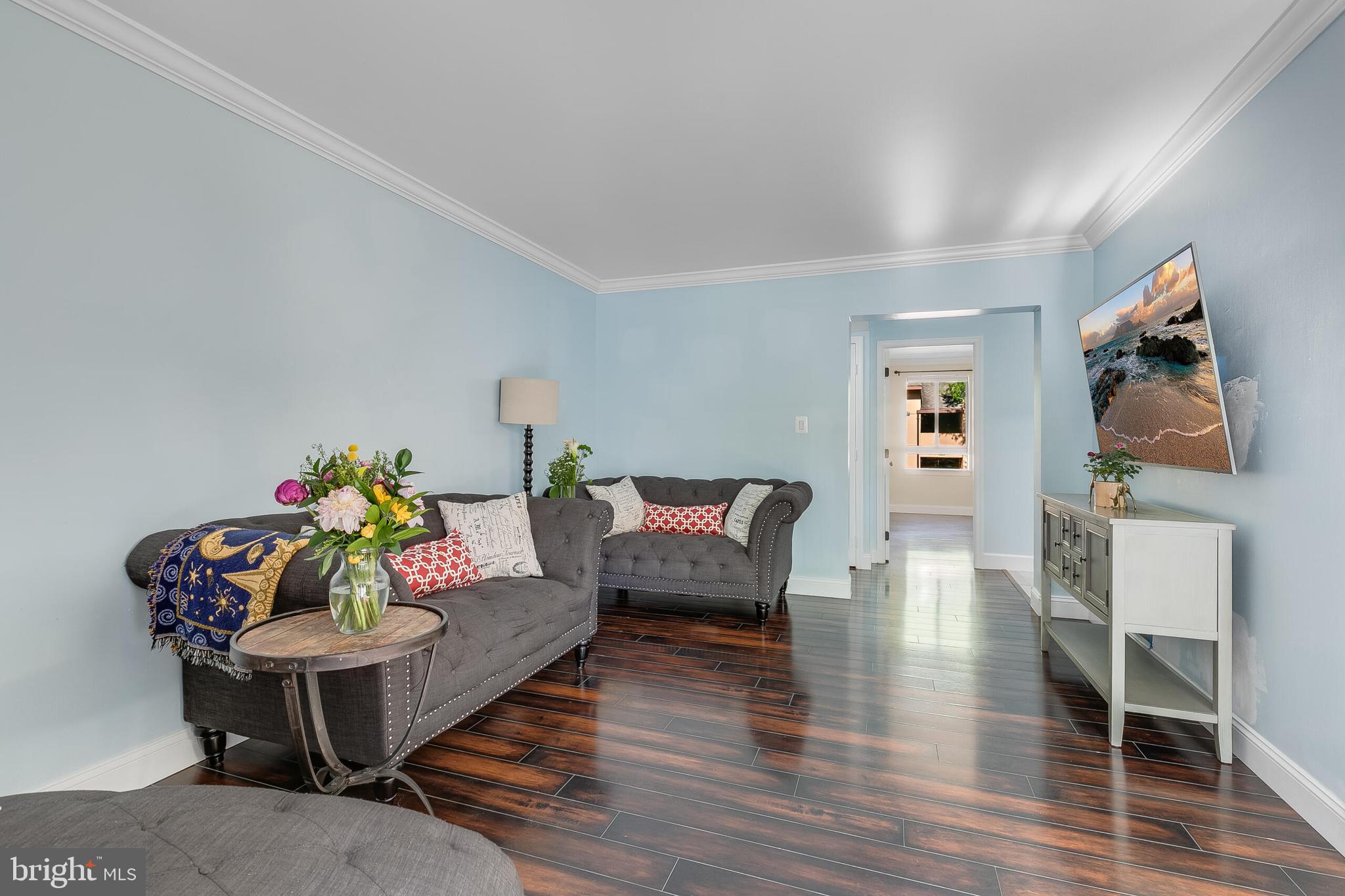 2255 Castle Rock Square, Unit 12C Reston, VA 20191 - Photo 9 of 29 a living room with furniture and a wooden floor