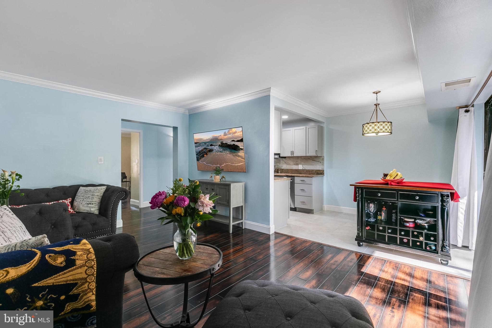 2255 Castle Rock Square, Unit 12C Reston, VA 20191 - Photo 10 of 29 a living room with furniture and a fireplace