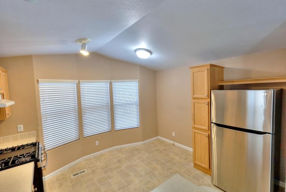 3506 Homestead Way Ceres, CA 95307 - Photo 16 of 39 a view of a kitchen with a refrigerator and a sink