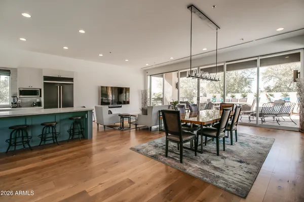 a view of a dining room with furniture window and wooden floor