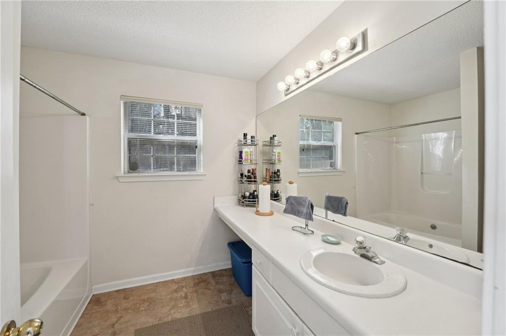 111 Bainbridge Court Dallas, GA 30132 - Photo 16 of 37 a bathroom with a sink and a mirror