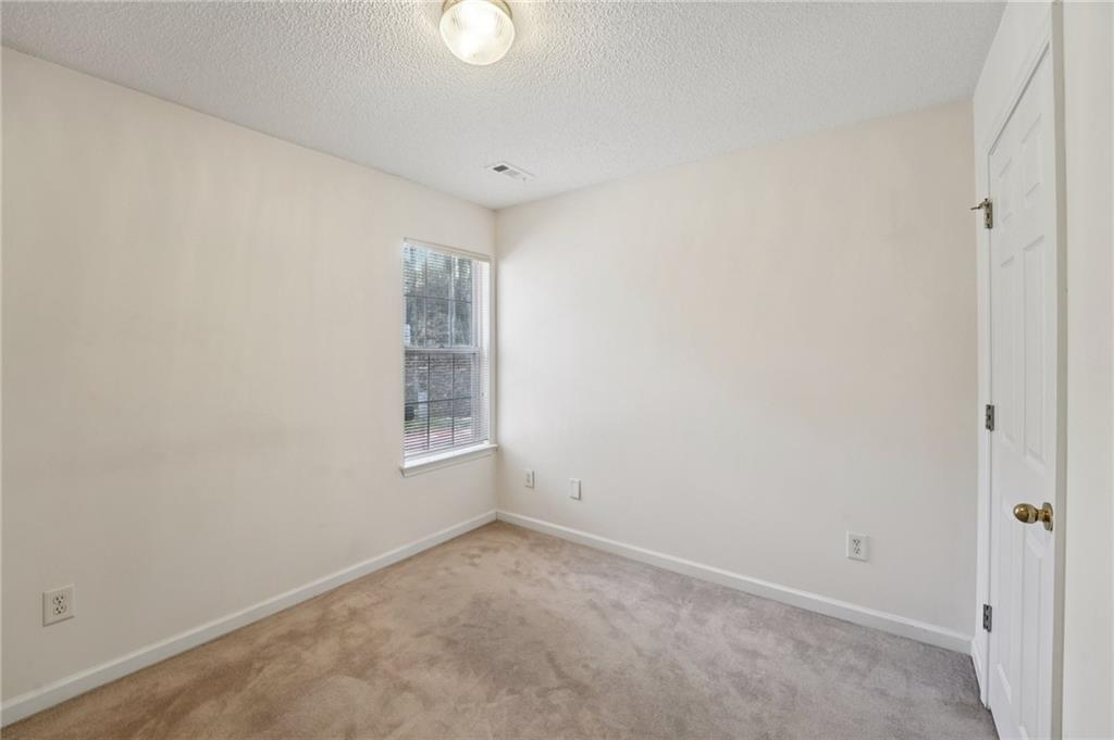 111 Bainbridge Court Dallas, GA 30132 - Photo 21 of 37 a view of an empty room with a window
