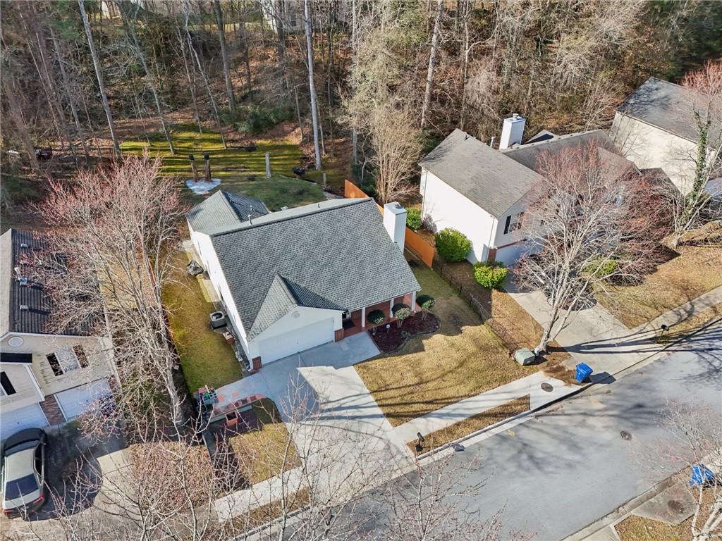 111 Bainbridge Court Dallas, GA 30132 - Photo 30 of 37 a view of a patio with chairs next to a yard