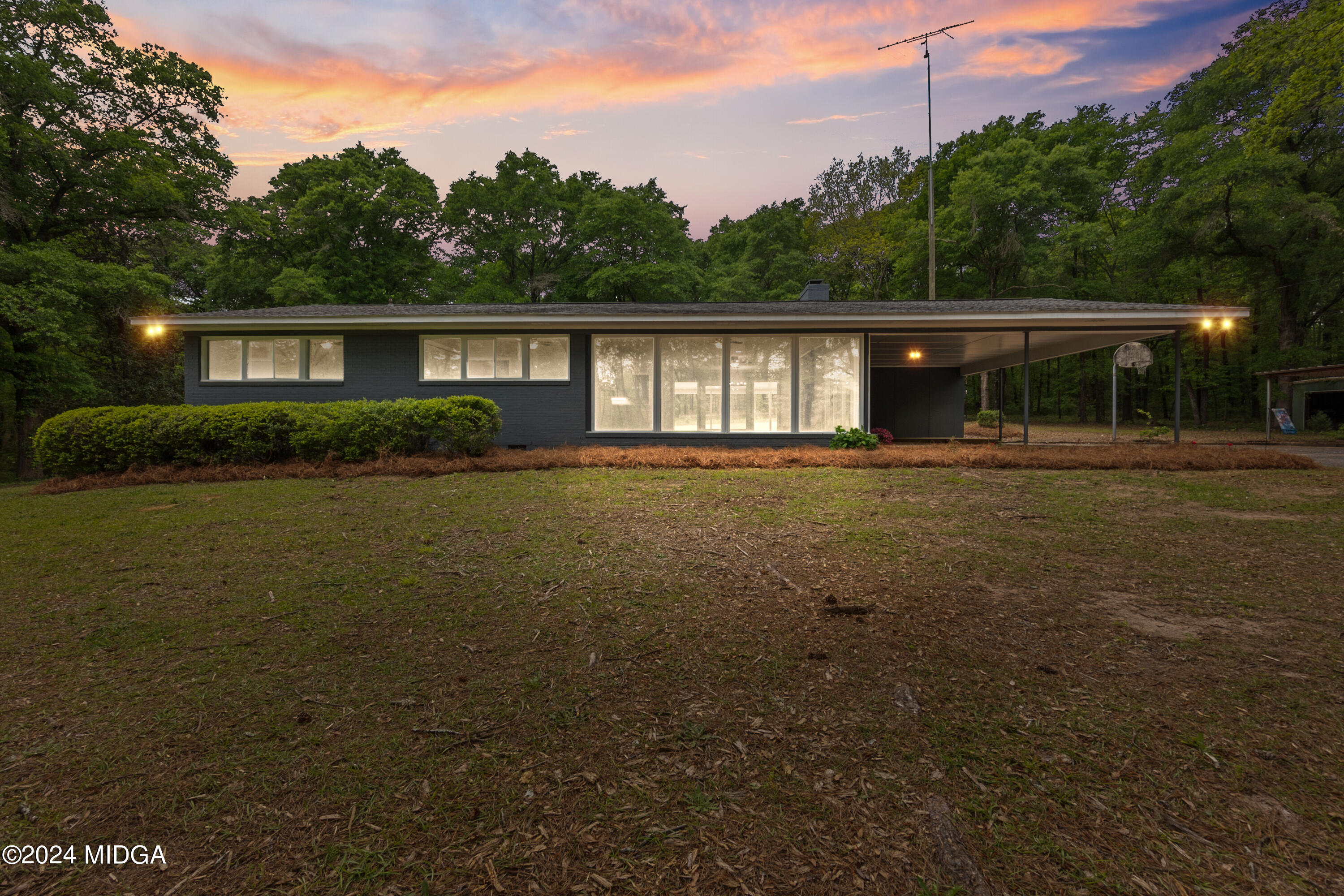 711 Country Club Road Fort Valley, GA 31030 - Photo 1 of 20 a front view of a house with a yard and trees