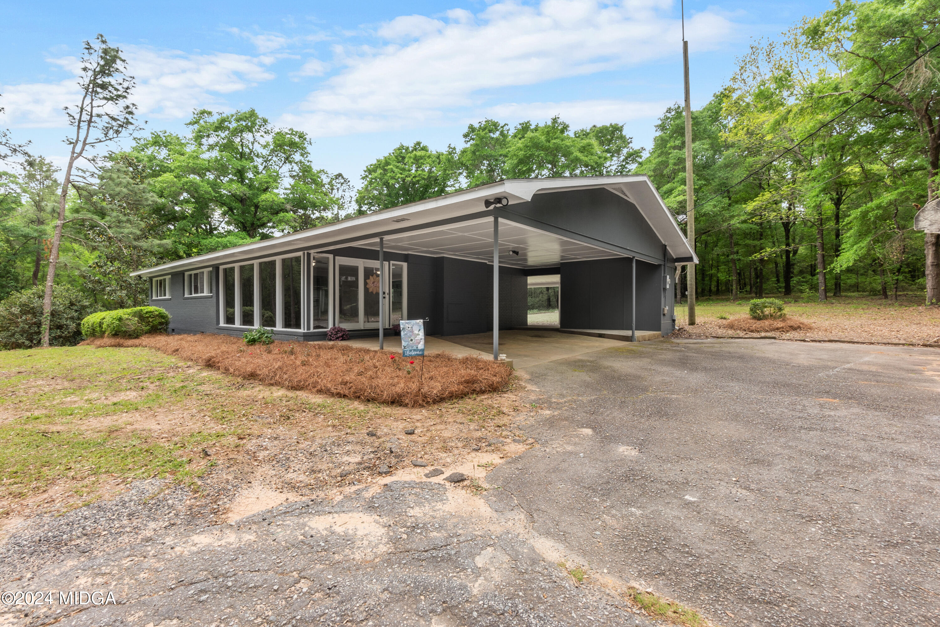 711 Country Club Road Fort Valley, GA 31030 - Photo 2 of 20 a view of a house with a yard
