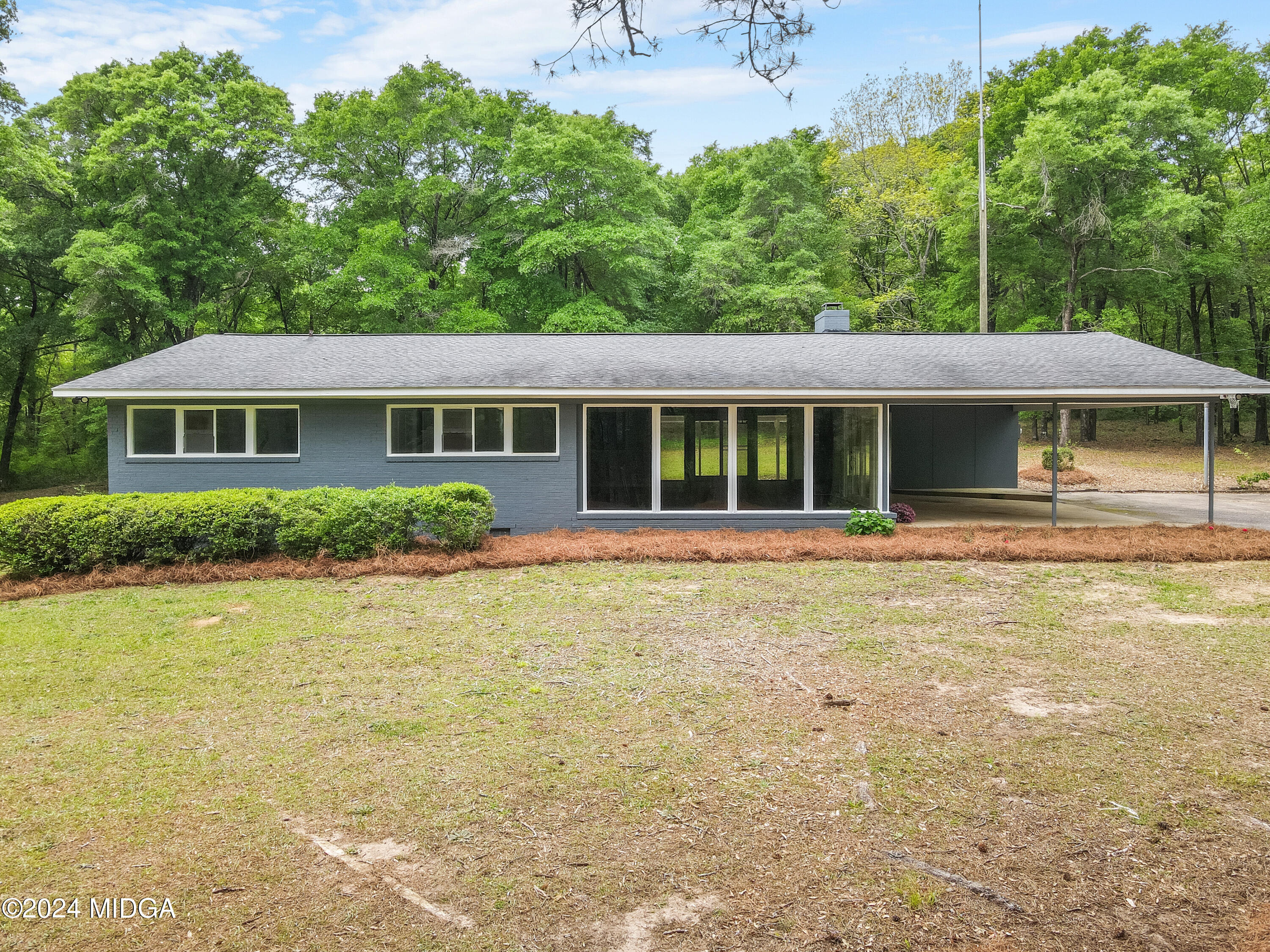 711 Country Club Road Fort Valley, GA 31030 - Photo 3 of 20 a front view of a house with a yard