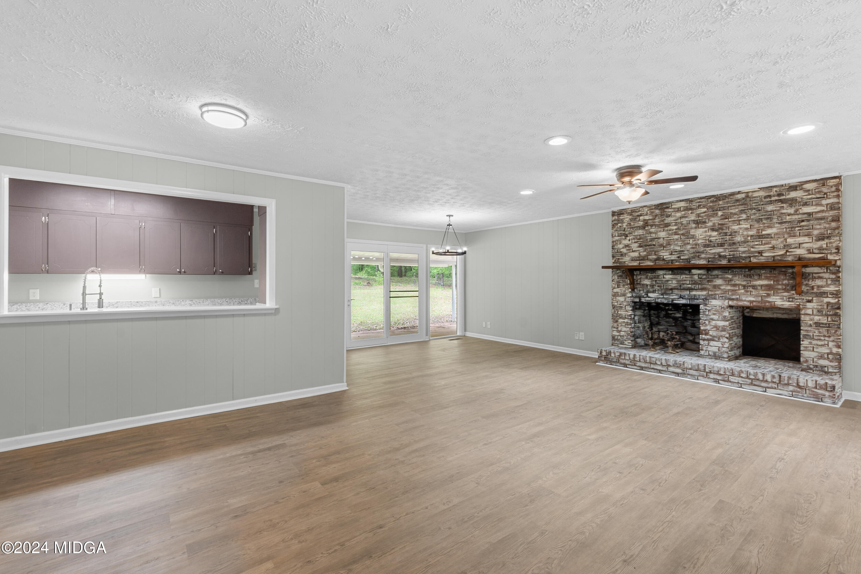 711 Country Club Road Fort Valley, GA 31030 - Photo 7 of 20 a view of an empty room with a fireplace