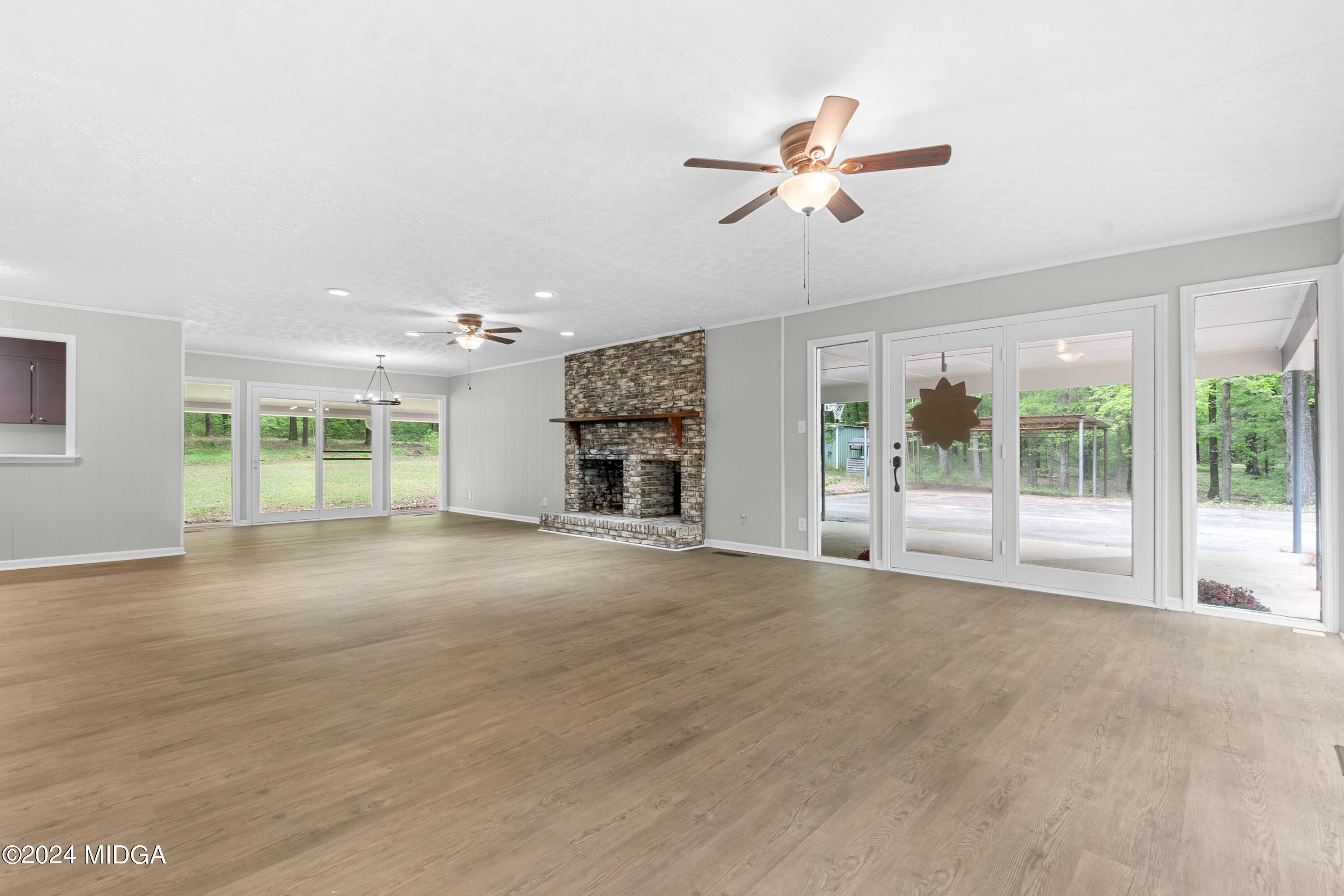 711 Country Club Road Fort Valley, GA 31030 - Photo 9 of 20 a view of a livingroom with a ceiling fan and window