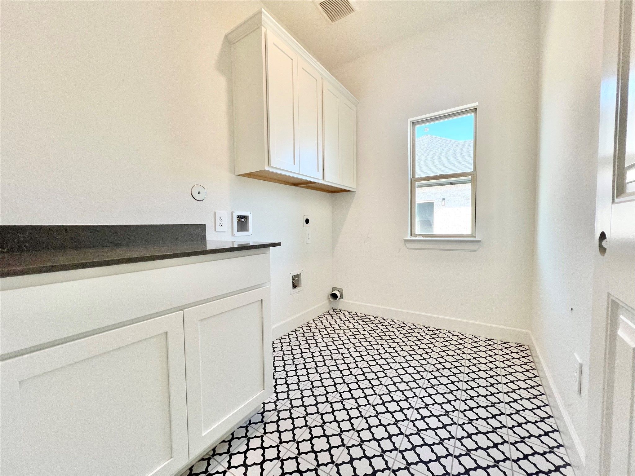 15722 North Tower Circle Santa Fe, TX 77517 - Photo 12 of 30 a bathroom with a sink a vanity and a window