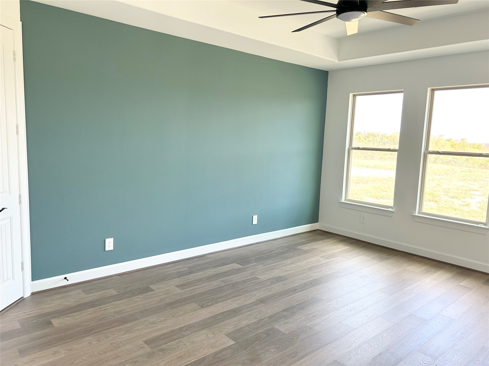 15722 North Tower Circle Santa Fe, TX 77517 - Photo 13 of 30 an empty room with wooden floor and windows