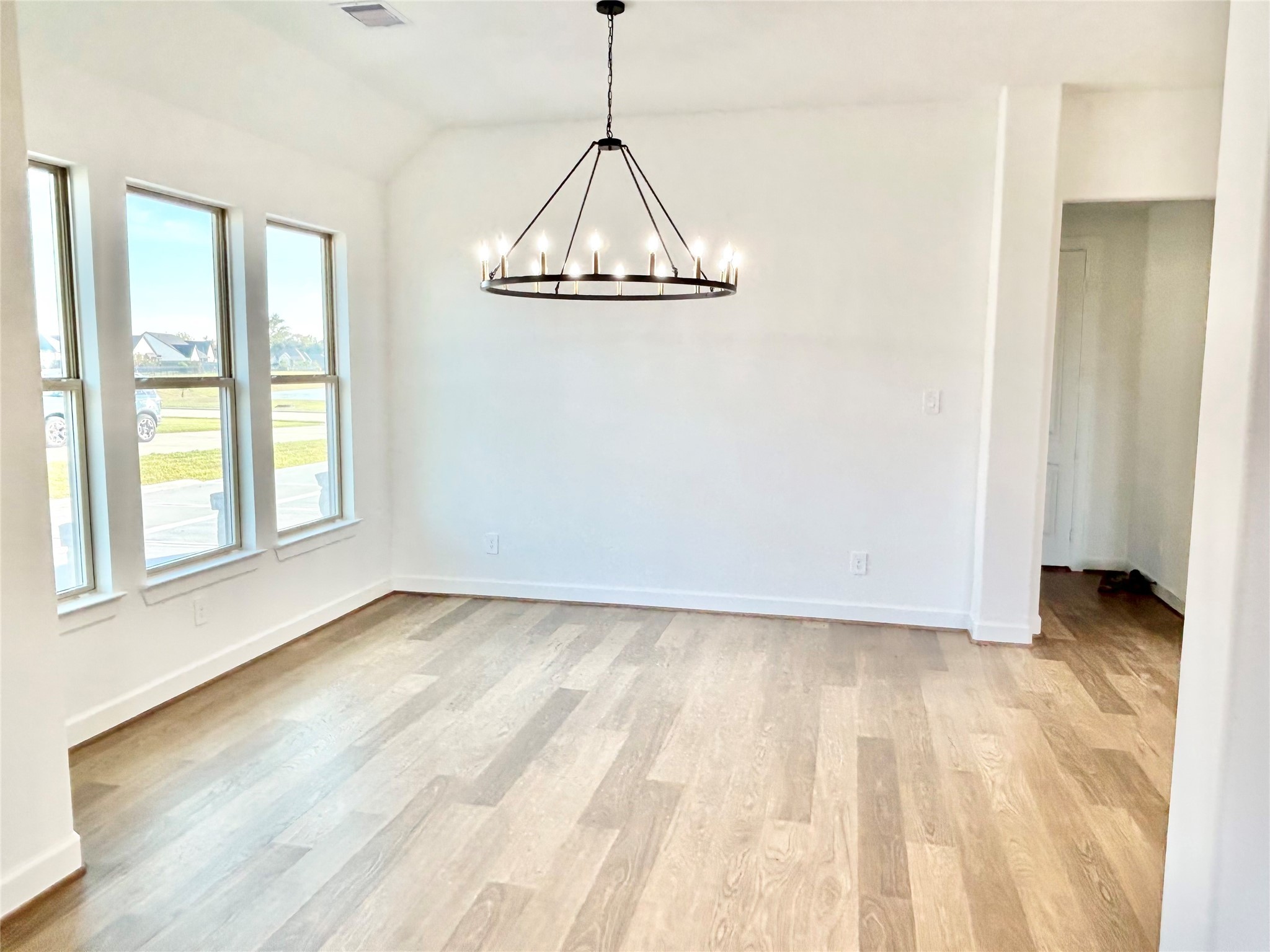 15722 North Tower Circle Santa Fe, TX 77517 - Photo 10 of 30 a view of a room with wooden floor and windows