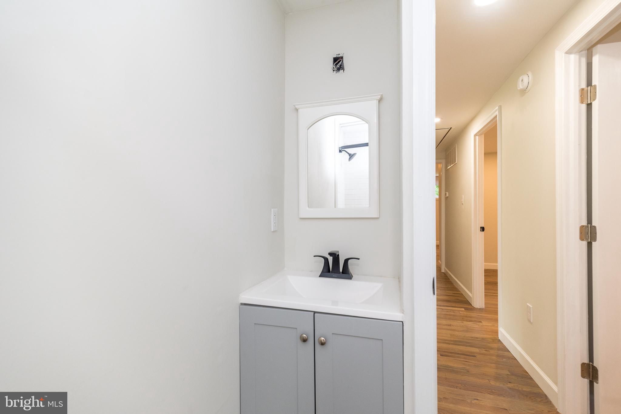 219 Stony Run Road Spring City, PA 19475 - Photo 25 of 35 a bathroom with a sink and a mirror