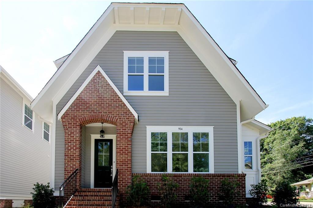 904 Millbrook Road, Unit 7A Charlotte, NC 28211 - Photo 1 of 22 a front view of a house with a yard