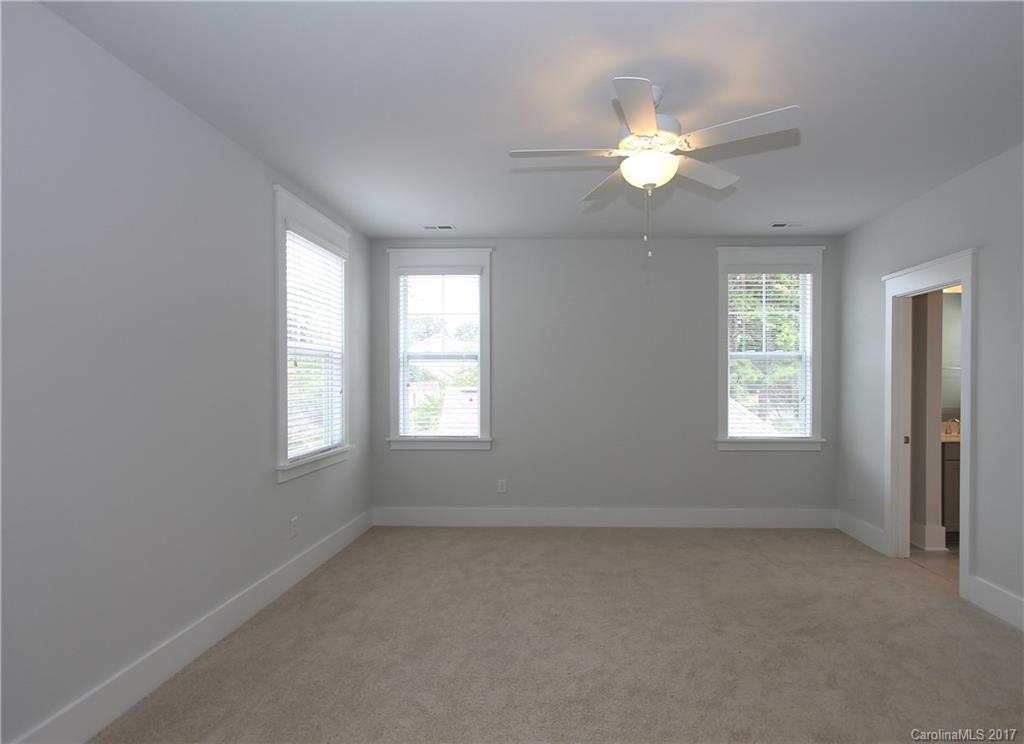 904 Millbrook Road, Unit 7A Charlotte, NC 28211 - Photo 11 of 22 wooden floor in an empty room with a window