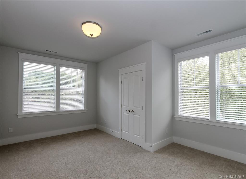 904 Millbrook Road, Unit 7A Charlotte, NC 28211 - Photo 17 of 22 a view of an empty room with a window and bathroom