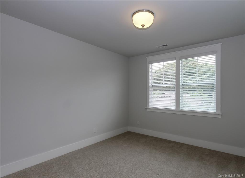 904 Millbrook Road, Unit 7A Charlotte, NC 28211 - Photo 18 of 22 an empty room with a window