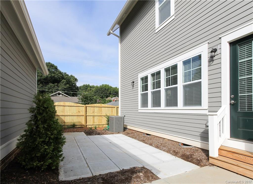 904 Millbrook Road, Unit 7A Charlotte, NC 28211 - Photo 19 of 22 a view of a house with a backyard