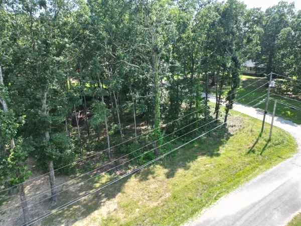 an aerial view of house with yard