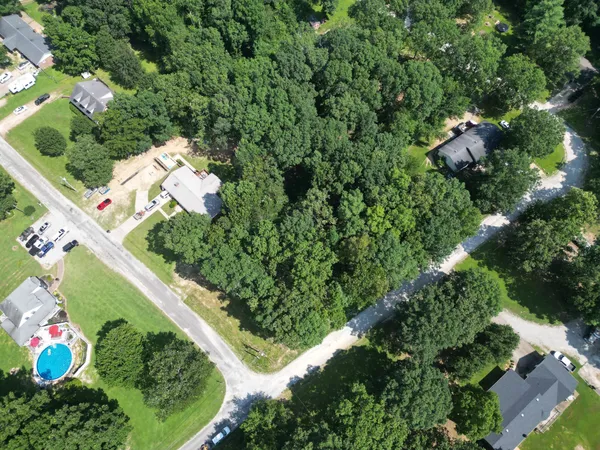 a backyard of a house and trees