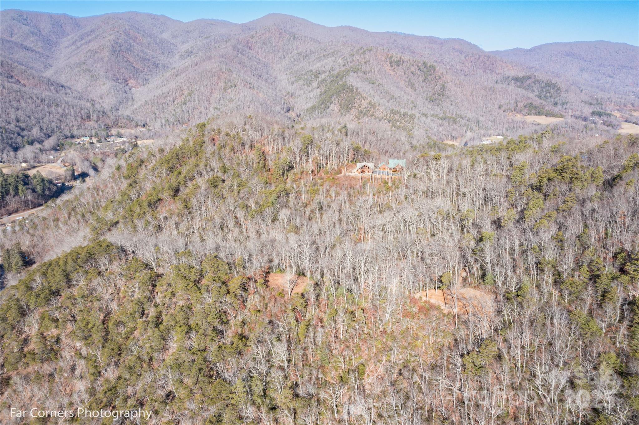 9999 Sourwood Road Canton, NC 28716 - Photo 26 of 33 a view of a dry yard with mountains in the background