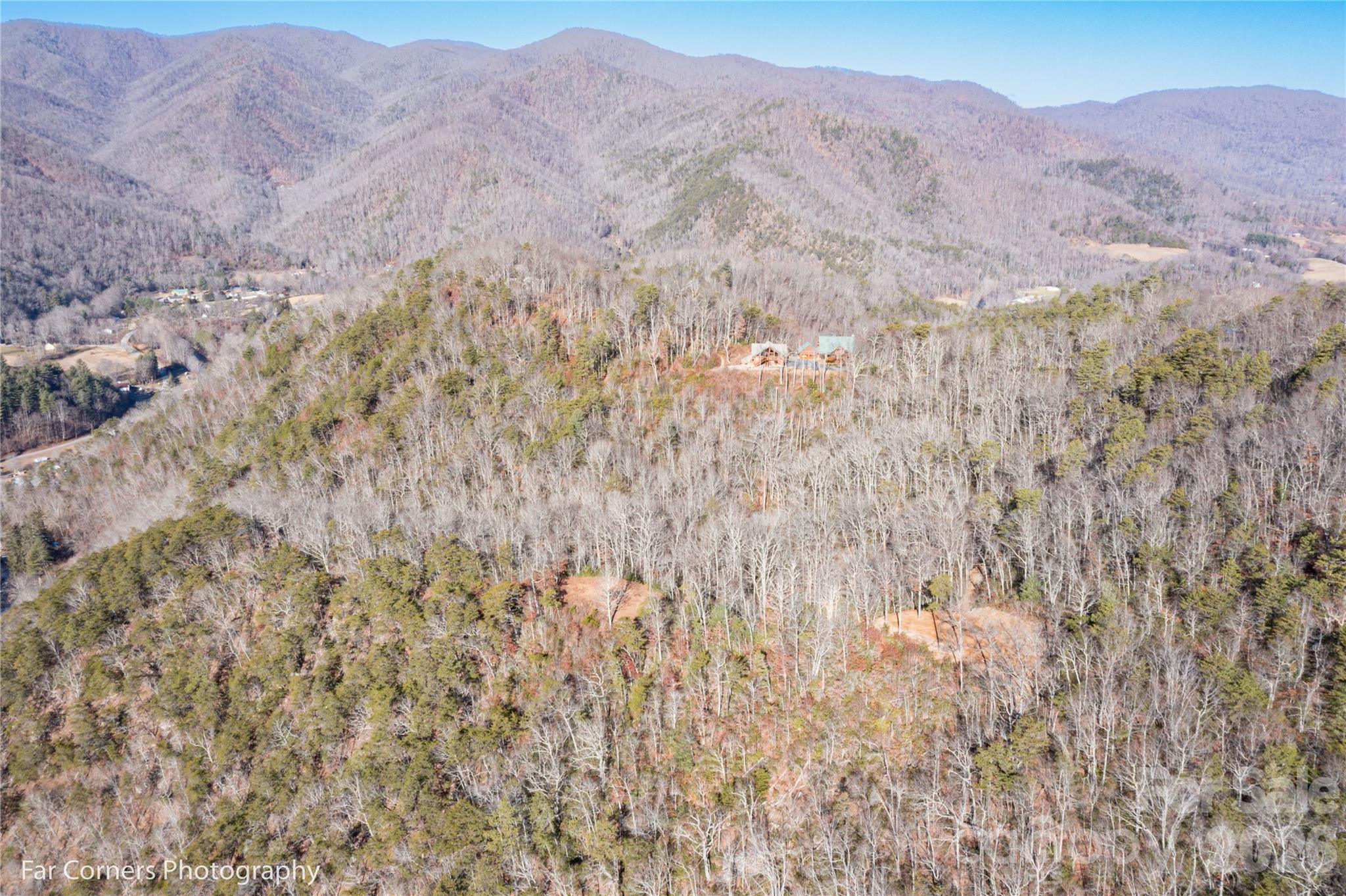 9999 Sourwood Road Canton, NC 28716 - Photo 27 of 33 a view of a dry yard with mountains in the background
