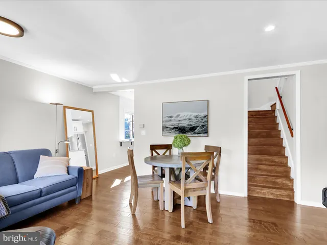 a view of a livingroom with furniture and wooden floor