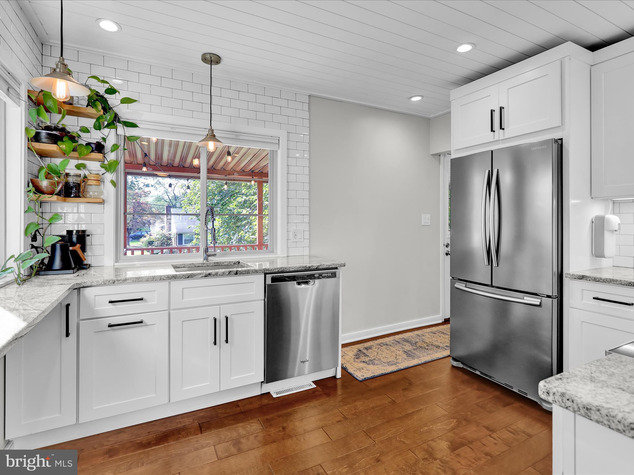 117 West Oregon Road Lititz, PA 17543 - Photo 6 of 34 a kitchen with stainless steel appliances granite countertop a refrigerator a sink a stove and white cabinets