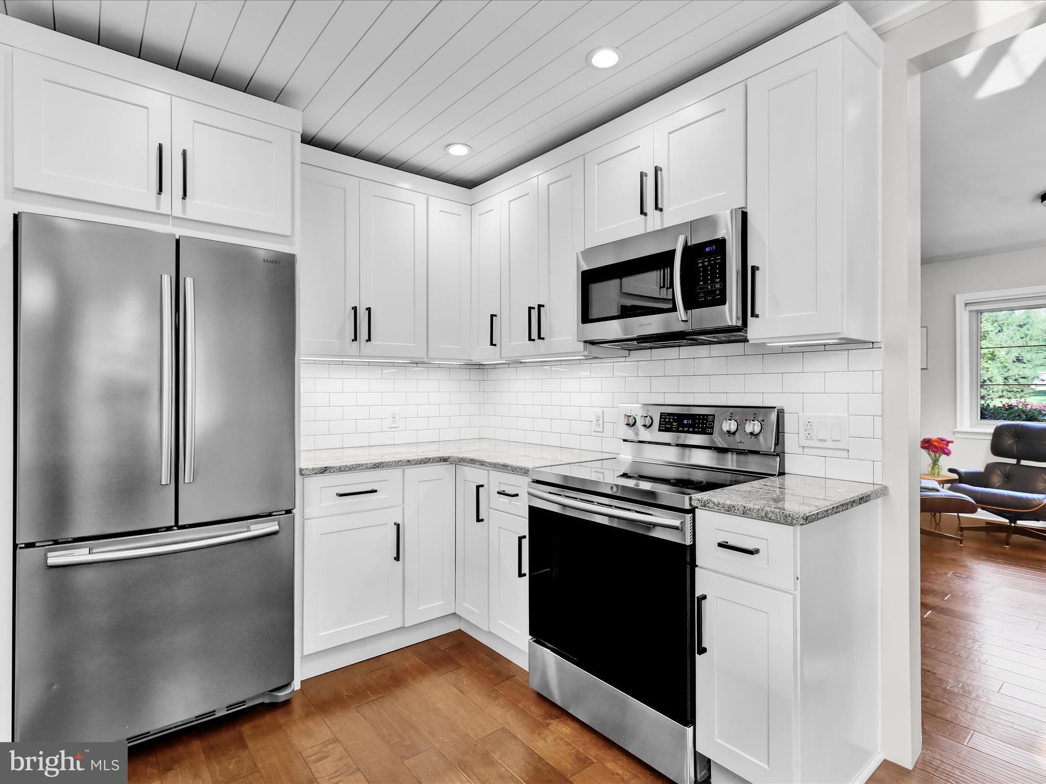 117 West Oregon Road Lititz, PA 17543 - Photo 7 of 34 a kitchen with stainless steel appliances a refrigerator stove and microwave