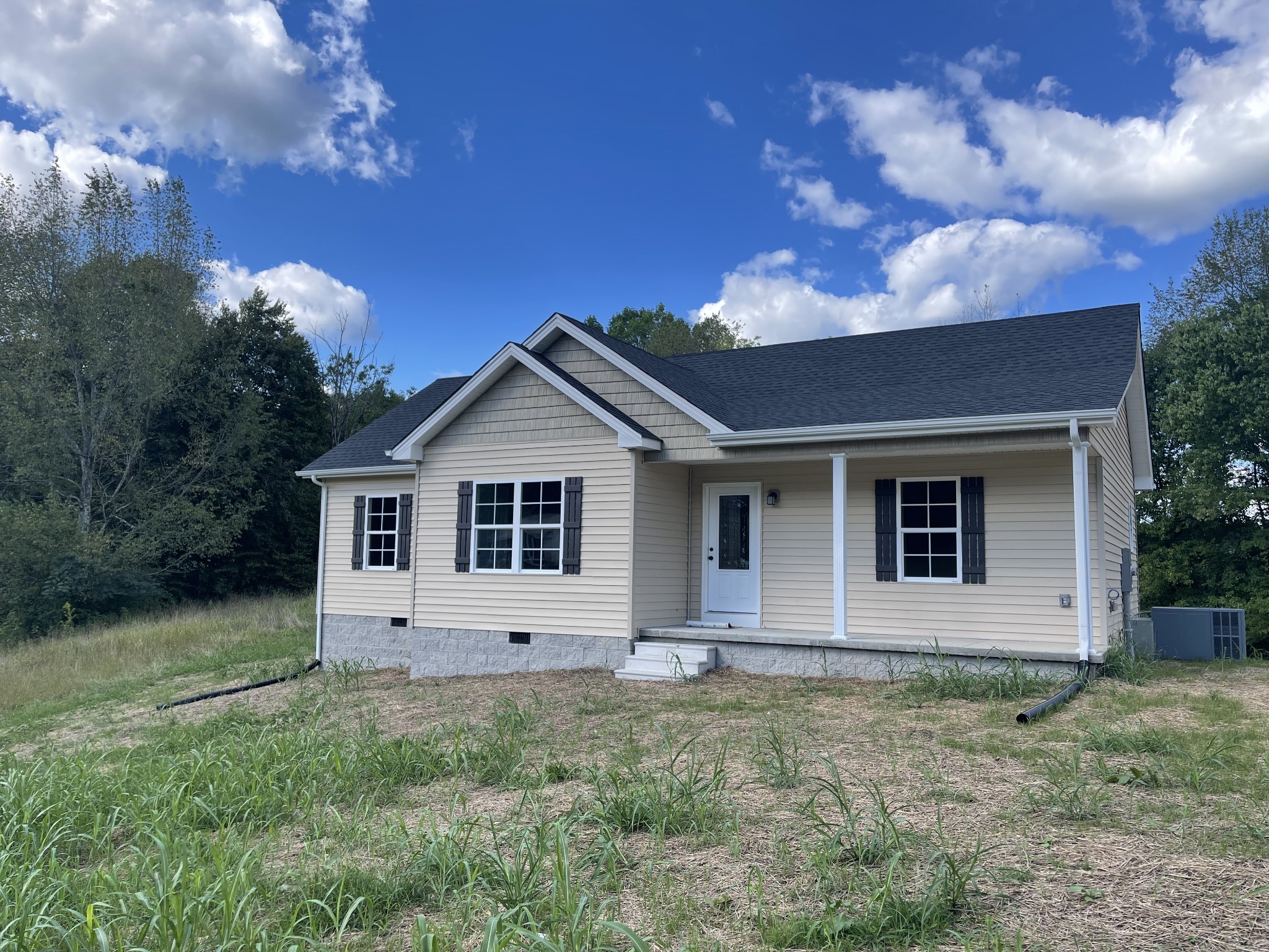 507 Days Road Lafayette, TN 37083 - Photo 3 of 13 a view of front of a house with a yard