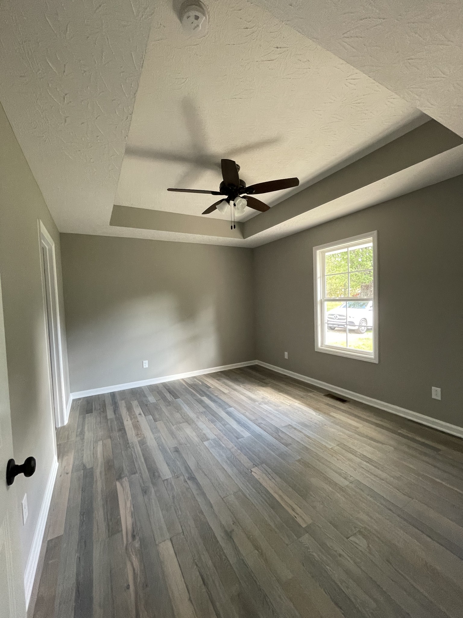 507 Days Road Lafayette, TN 37083 - Photo 8 of 13 wooden floor in an empty room with a window