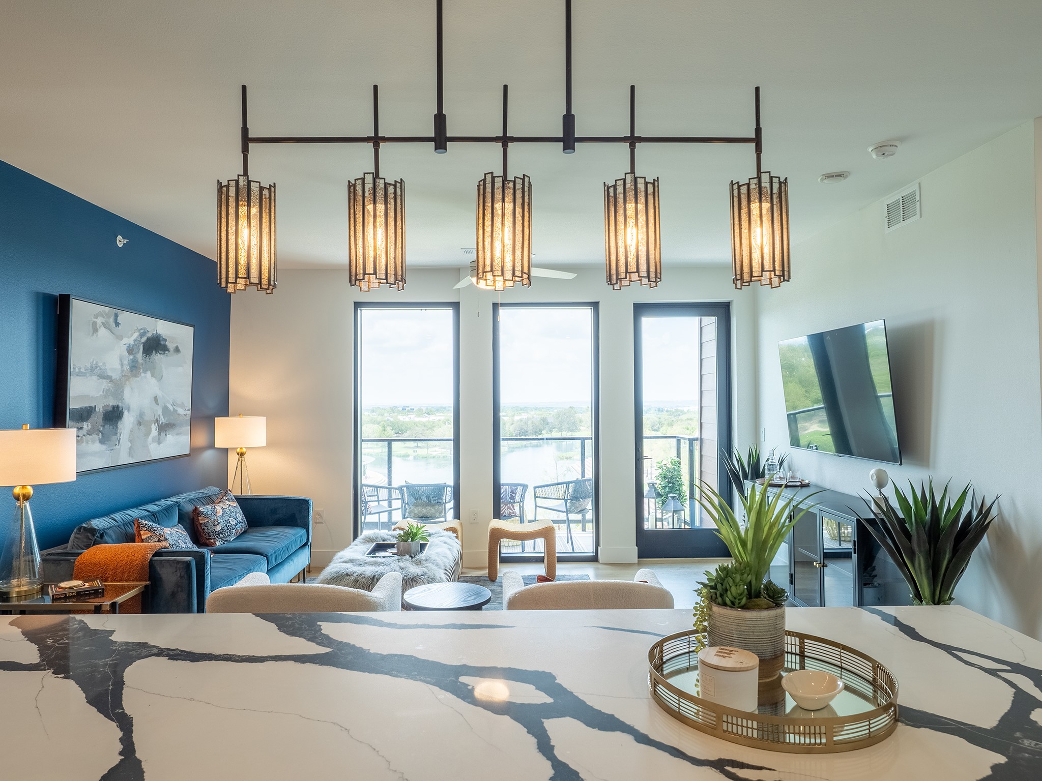 1701 Simond Avenue, Unit 531 Austin, TX 78723 - Photo 4 of 34 a living room with furniture and a chandelier