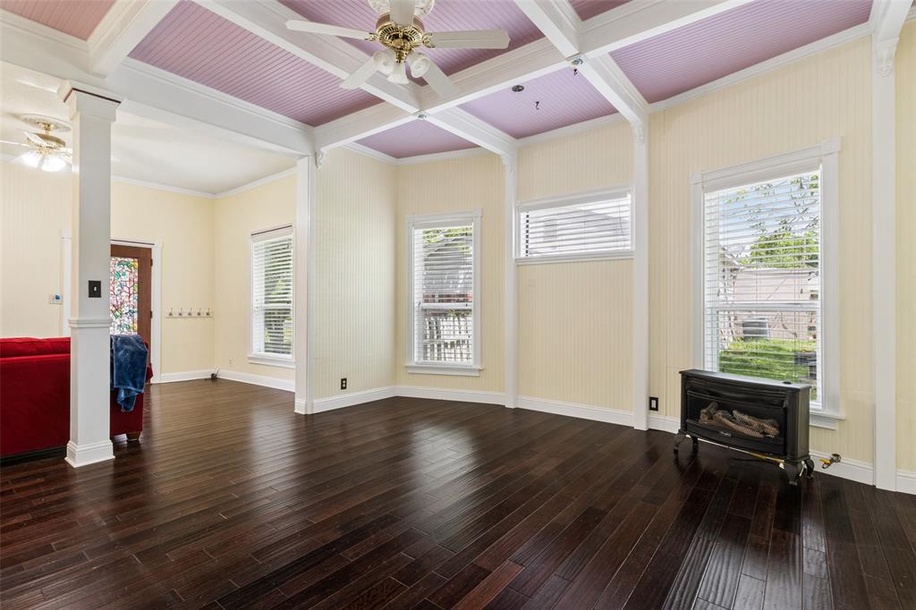 5824 Boone Street Sachse, TX 75048 - Photo 8 of 40 a view of an empty room with wooden floor and a window