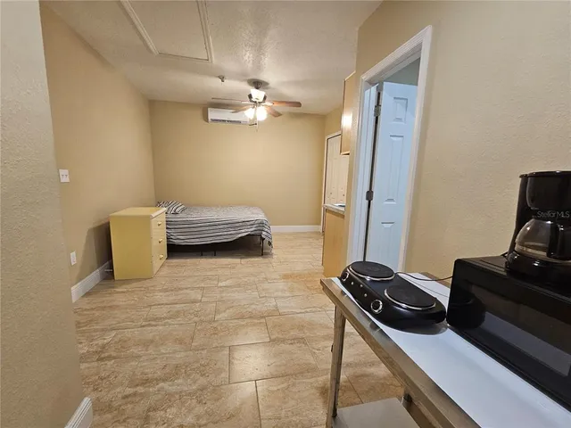a bedroom with a bed and a desk