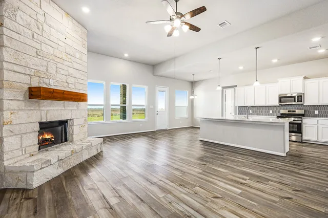 a view of kitchen with cabinets and wooden floor