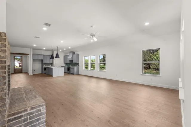 a view of kitchen and kitchen with furniture and a refrigerator