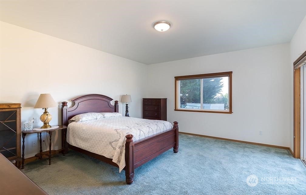 2493 Atterberry Road Sequim, WA 98382 - Photo 23 of 29 a bedroom with a bed and a window