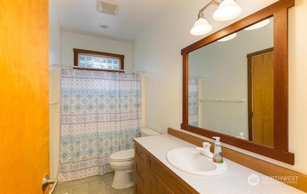2493 Atterberry Road Sequim, WA 98382 - Photo 28 of 29 a bathroom with a sink a toilet and shower