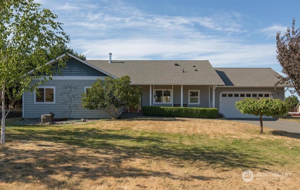 2493 Atterberry Road Sequim, WA 98382 - Photo 5 of 29 a front view of a house with a yard