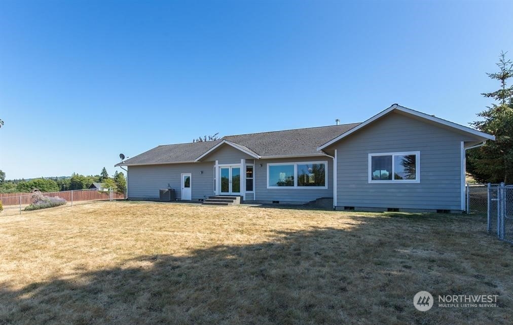 2493 Atterberry Road Sequim, WA 98382 - Photo 7 of 29 a view of a house with a yard