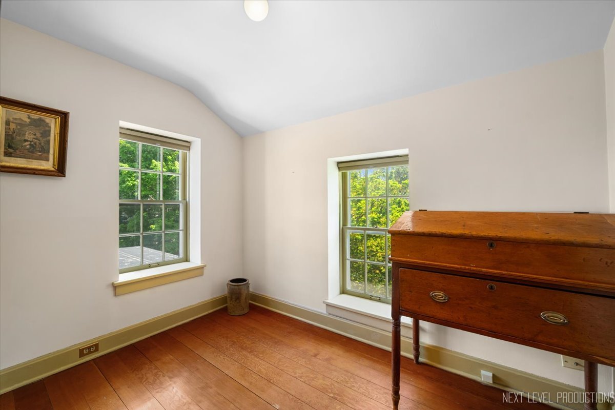 301 South 1st Street Geneva, IL 60134 - Photo 17 of 25 a room with a window and a chair